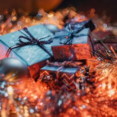 a pile of wrapped presents sitting on top of a table